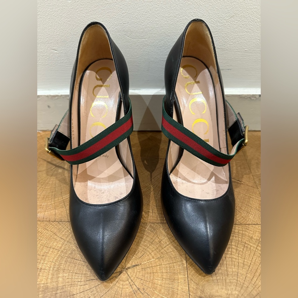 Gucci black heels with gucci strap.